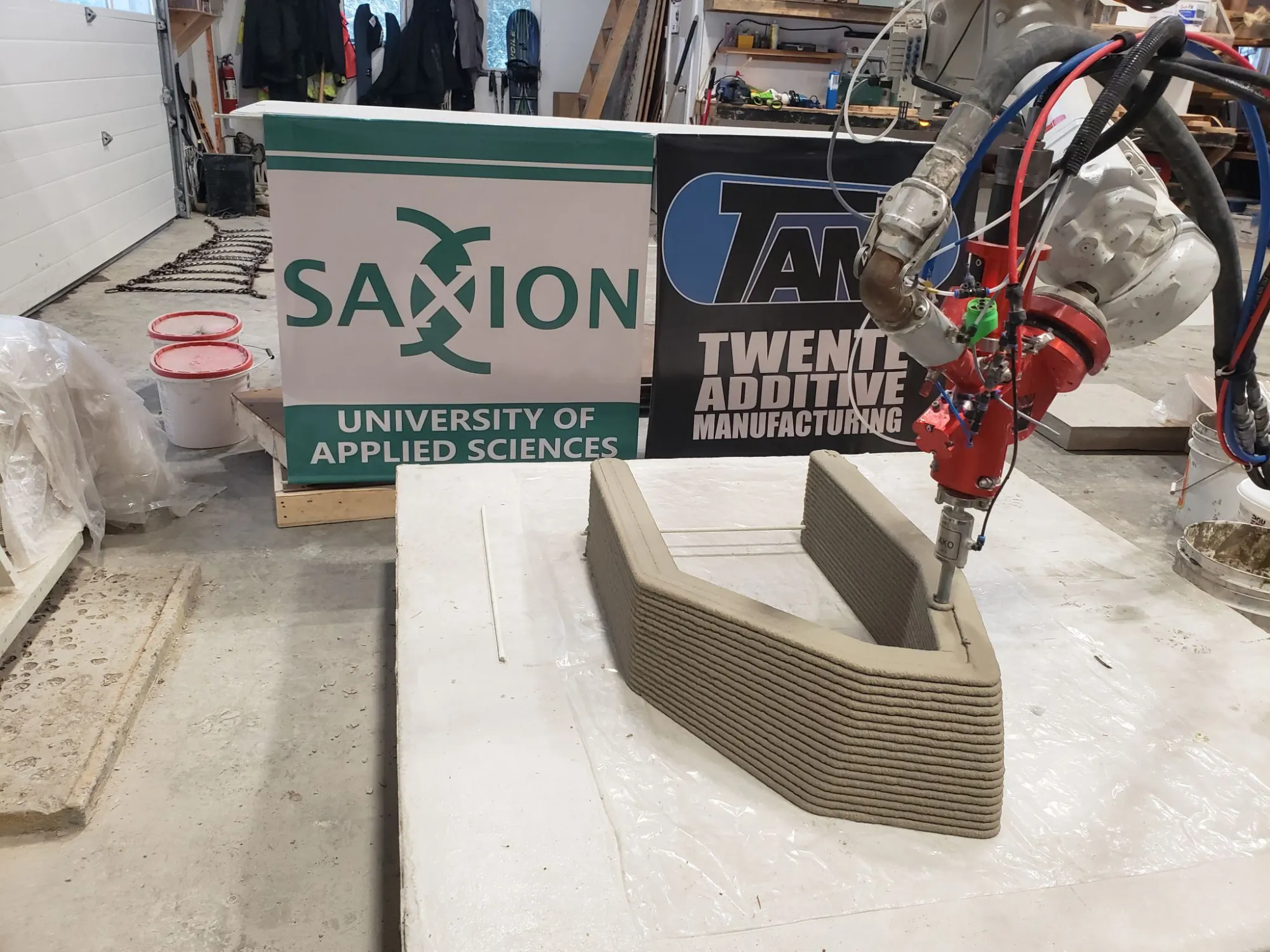 Wide view of the robotic concrete printing process used to fabricate the Canadian fish-ladder steps
