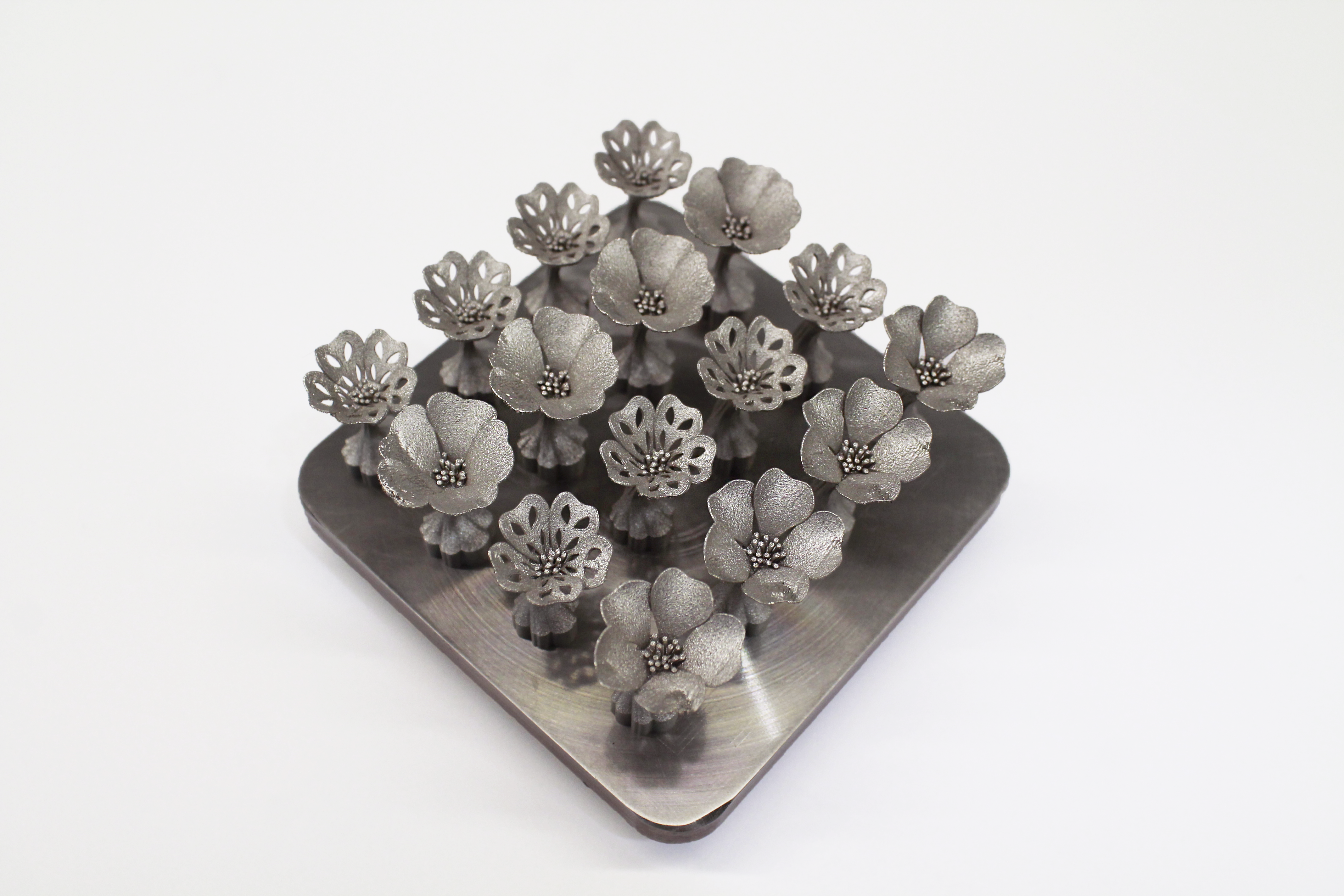 Angled view of the cufflink designs arranged together on their print bed