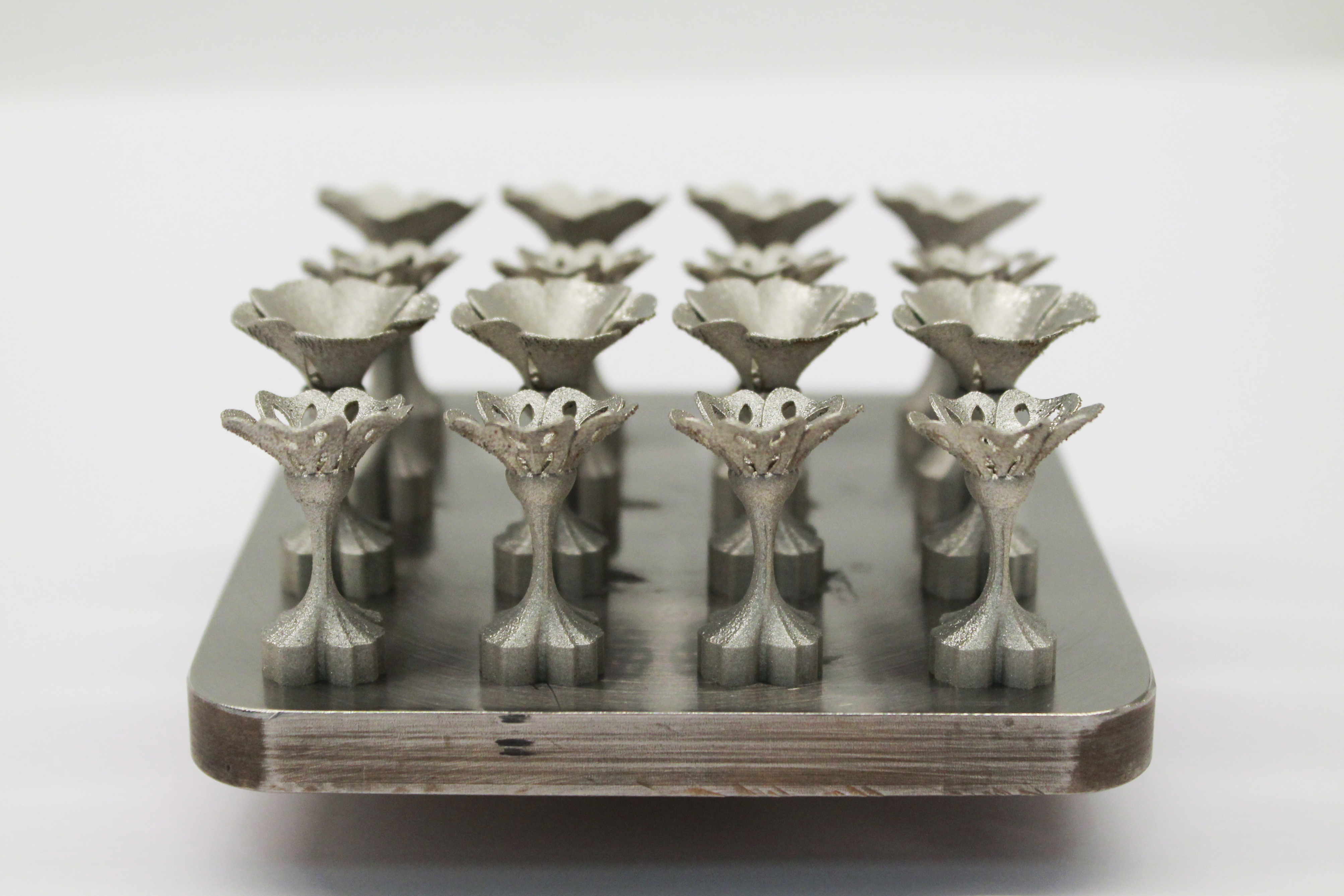 Side view of the printed cufflinks showing the flower heads, stems and bases