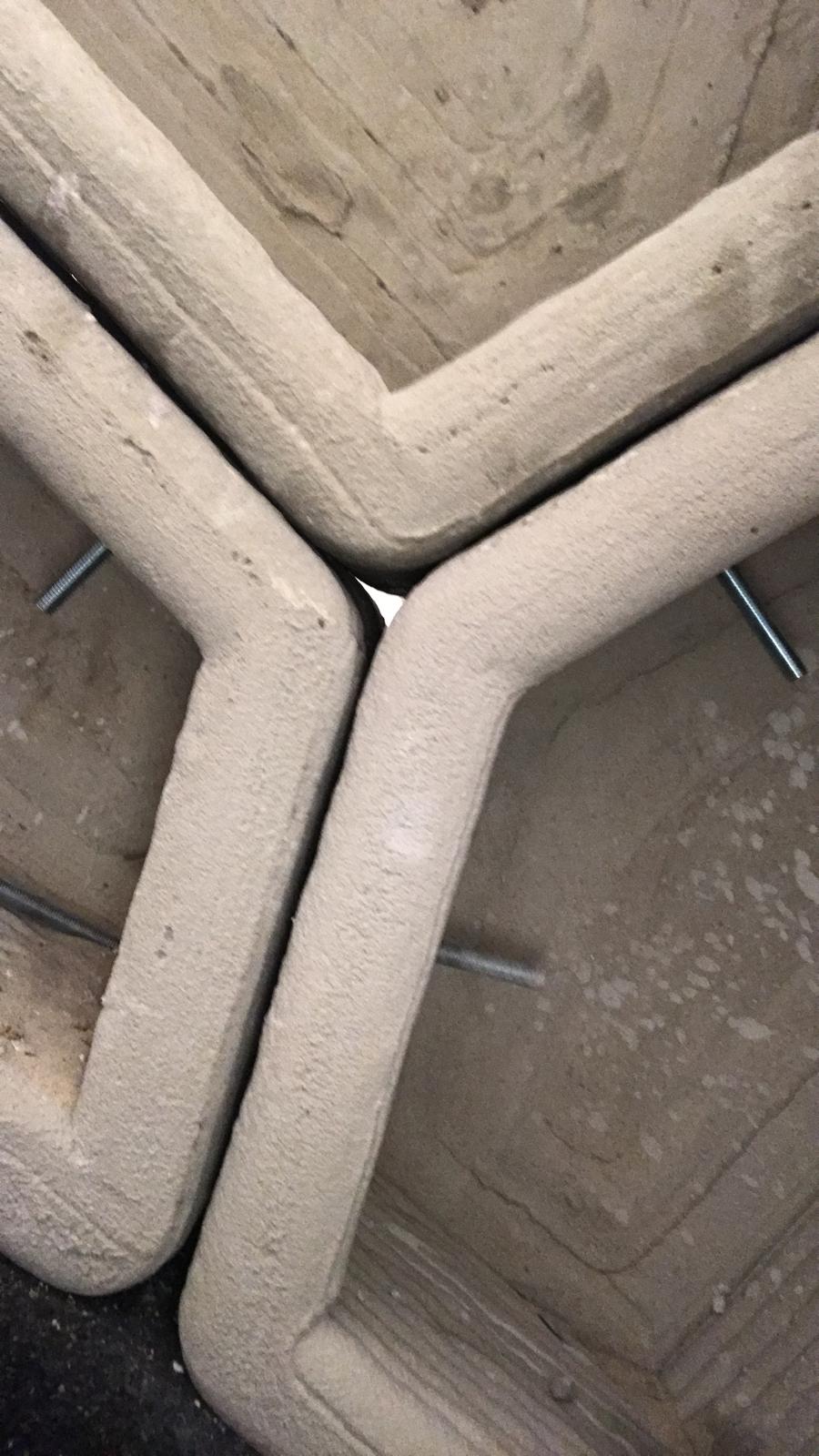 Close-up of the joints between three printed concrete blocks
