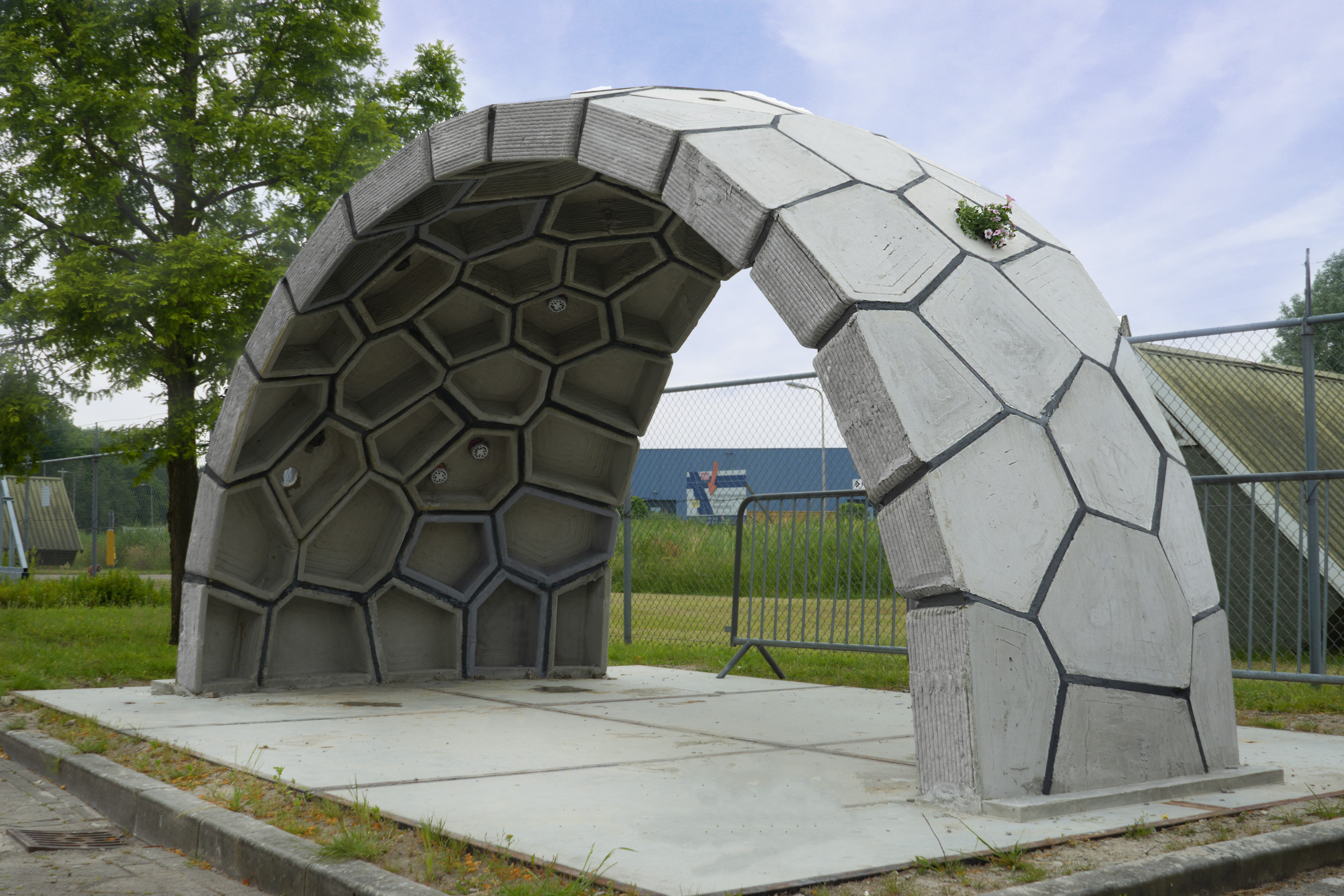 Completed concrete dome showing its polygonal blocks and open arch
