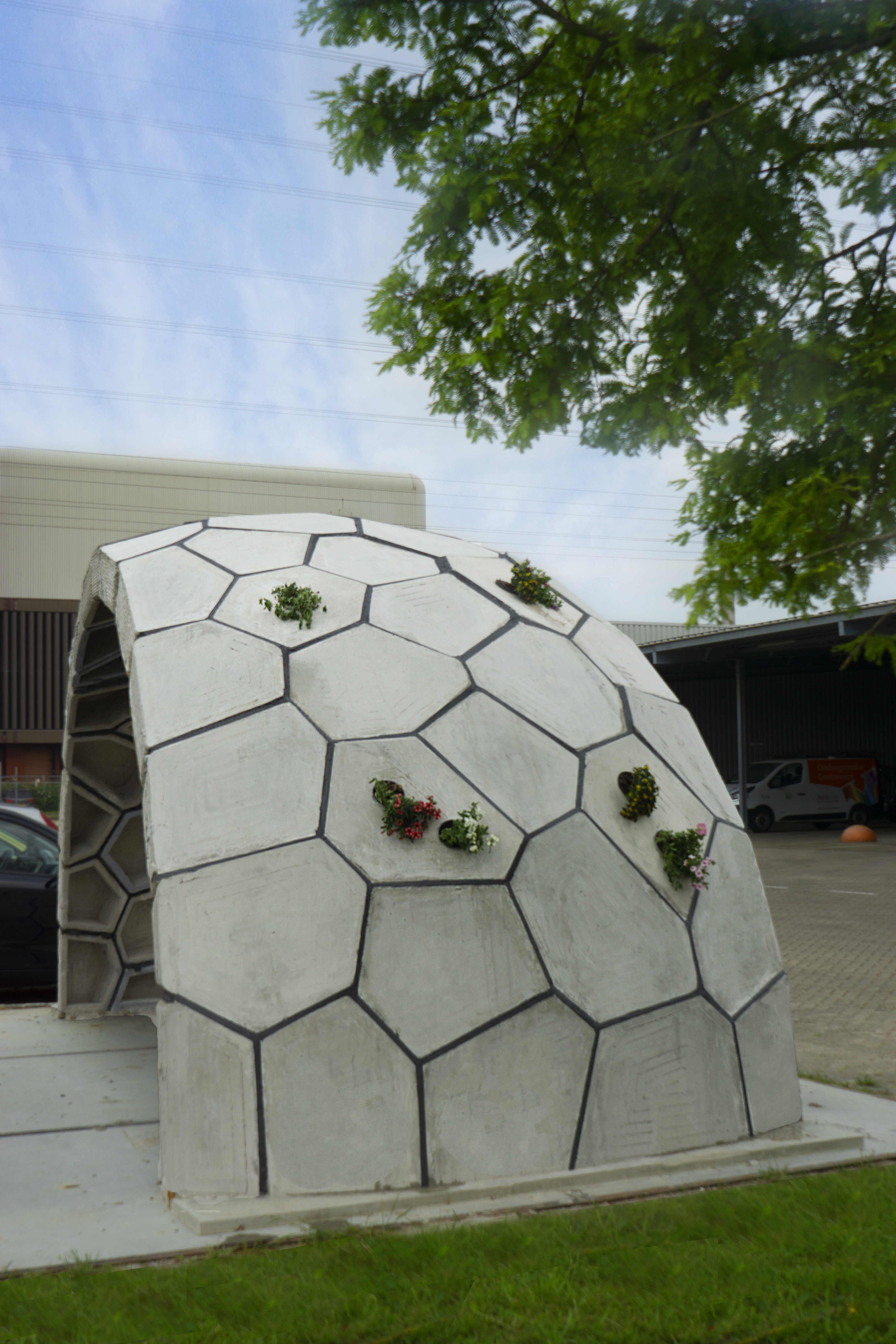 Finished dome exterior with plants set into selected concrete blocks