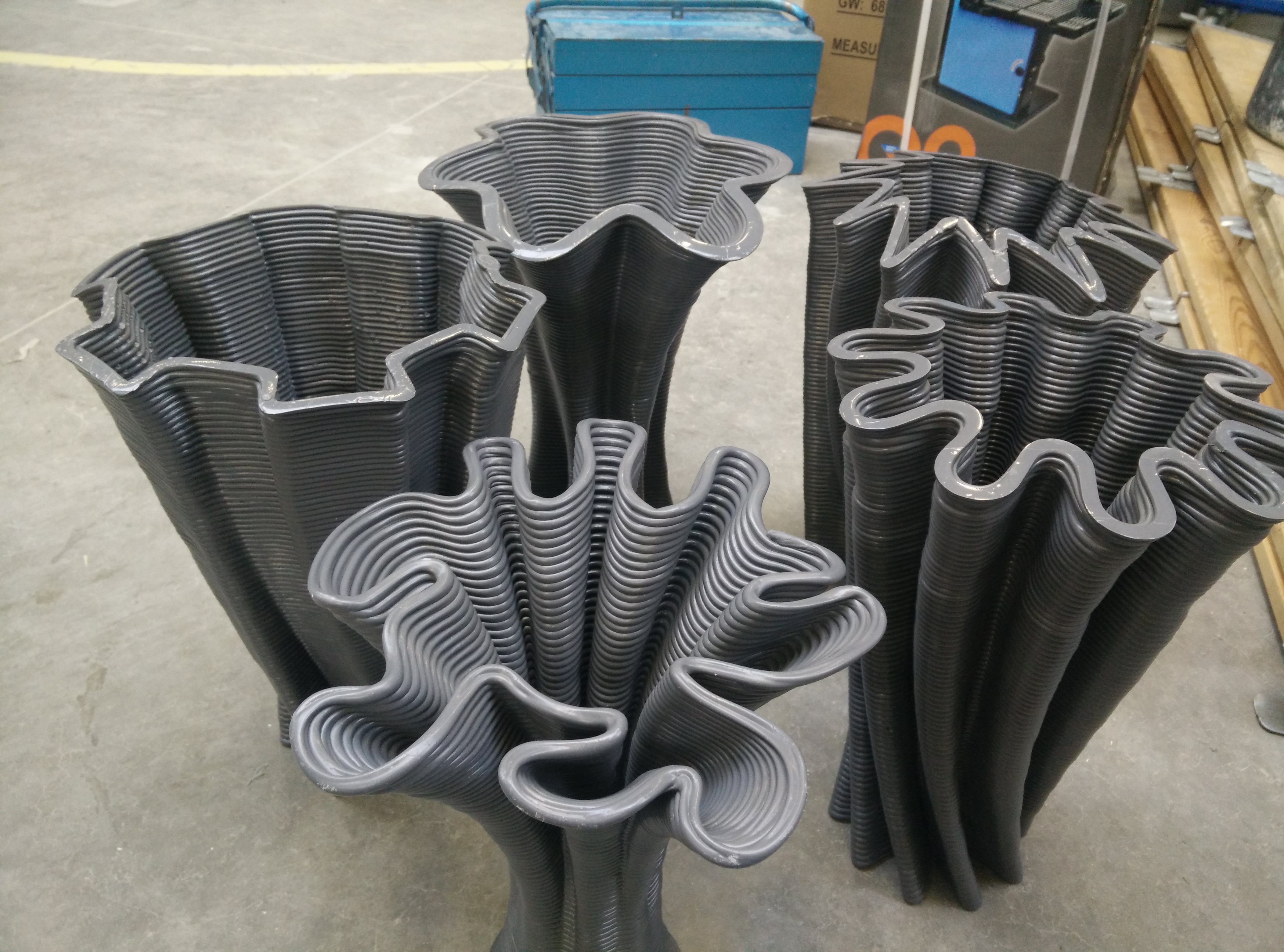 Printed vase experiments showing varied lobes, twists and open rims