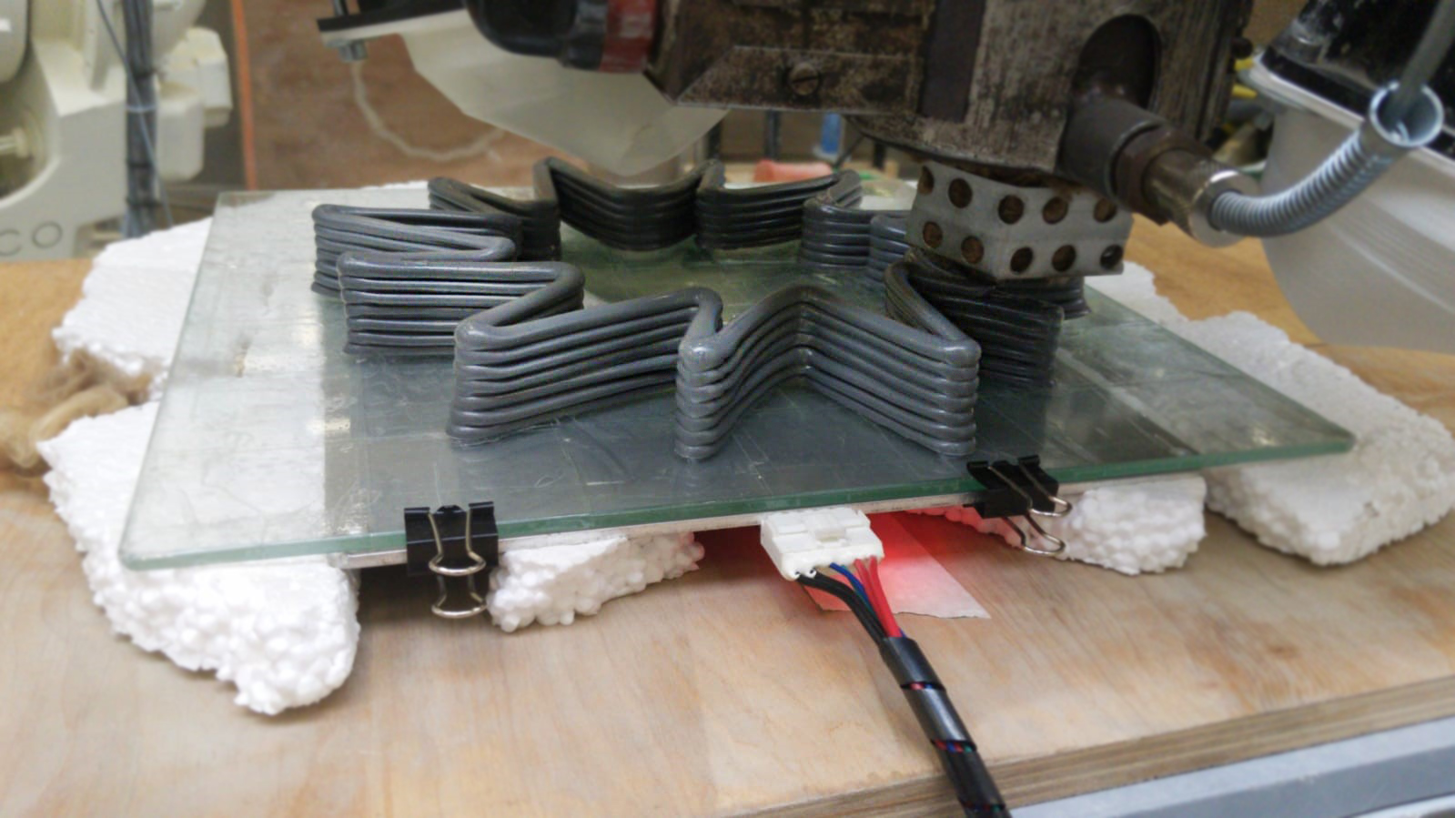 A lobed vase profile being printed in layers onto a glass build plate