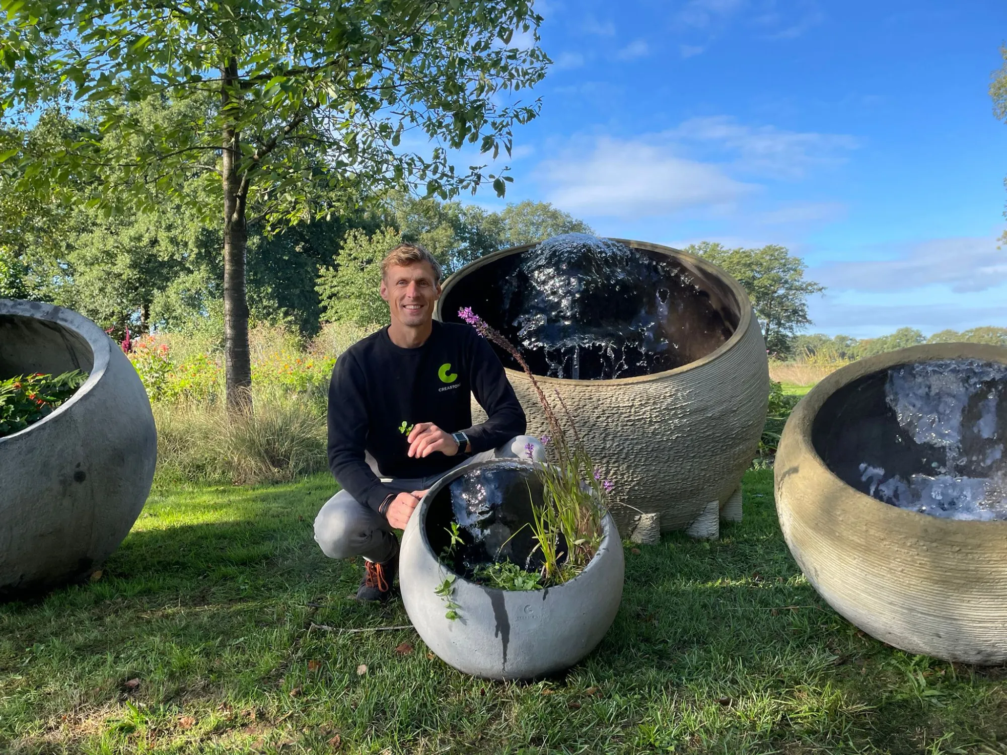 Creastone designer with a collection of finished spherical water features