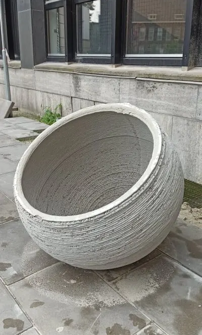 Small concrete-printed spherical prototype used to test the production strategy